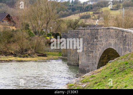 historic stone bridge at a small rural village named Oberregenbach near Langenburg in Hohenlohe, a area in Southern Germany Stock Photo