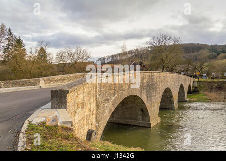 historic stone bridge at a small rural village named Oberregenbach near Langenburg in Hohenlohe, a area in Southern Germany Stock Photo