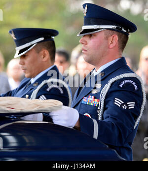 Blue Eagles Honor Guard members Senior Airman Joseph Trujillo (right) and Senior Airman Archie Daquioag (left) fold a flag over the casket of retired U.S. Air Force Master Sgt. Johnny B. Hillary while performing funeral honors Jan. 14, 2016, at Riverside National Cemetery in Riverside, California. Hillary was an Air Force Junior ROTC instructor and also served in the California State Military Reserve as a chaplain assistant attached to the California Air National Guard's 163d Attack Wing. (Air National Guard Photo by Airman 1st Class Crystal Chatham Housman)(Released) Stock Photo