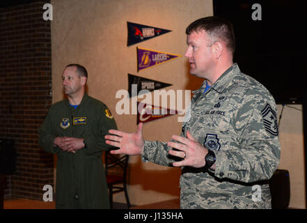 Col. Gentry Boswell, 28th Bomb Wing commander, and Chief Master Sgt. Adam Vizi, 28th Bomb Wing command chief, speak on the importance of the Air Force Assistance Fund inside the Dakota’s Cub at Ellsworth Air Force Base, S.D., March 31, 2017. If interested in donating contact a unit AFAF representative. For more information on the different charities, call (800) 258-1413 for Air Force Enlisted Village, (800) 554-5510 for the General and Mrs. Curtis E. LeMay Foundation, (800) 655-3083 for Air Force Villages Indigent Widows' Fund, and (703) 972-2650 for Air Force Aid Society. (U.S. Air Force phot Stock Photo