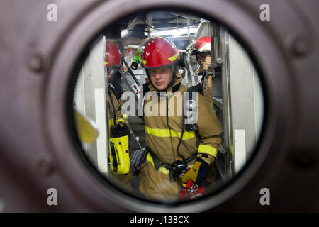 170408-N-ZW825-247 PACIFIC OCEAN (April 8, 2017) Machinist’s Mate 3rd Class Colby Sisco, a Birmingham, Alabama native, prepares to enter a main machinery room aboard Arleigh Burke-class guided-missile destroyer USS Sterett (DDG 104) during a main space fire drill.  Sterett is part of the Sterett-Dewey Surface Action Group and is the third deploying group operating under the command and control construct called 3rd Fleet Forward. U.S. 3rd Fleet operating forward offers additional options to the Pacific Fleet commander by leveraging the capabilities of 3rd and 7th Fleets. (U.S. Navy photo by Mas Stock Photo