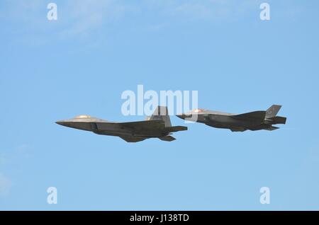 USAF Lockheed Martin F-22A Raptor and F-35A Lightning II Stealth Fighter Jets Stock Photo