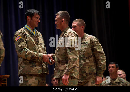 Vice Chief of Staff of the Army General Daniel B Allyn, and Sergeant Major of the Army Daniel Dailey congratulate U.S. Army Ranger Master Sgt. Josh Horsager of the 75th Ranger Regiment for winning first place in the Best Ranger Competition 2017 at Fort Benning, Ga., April 10, 2017. The 34th annual David E. Grange Jr. Best Ranger Competition 2017 is a three-day event consisting of challenges to test competitor's physical, mental, and technical capabilities. (U.S Army Photo by Spc. Kristen Dobson) Stock Photo