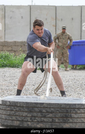 A Joint Task Force soldier participates in recycling initiatives to ...