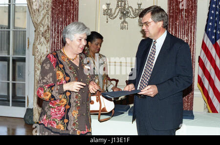 woman accepting award taking a picture Stock Photo