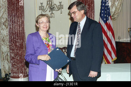 woman accepting award taking a picture Stock Photo