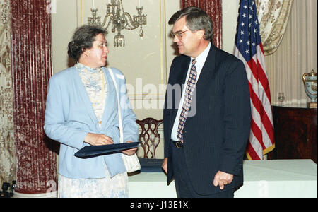 woman accepting award taking a picture Stock Photo