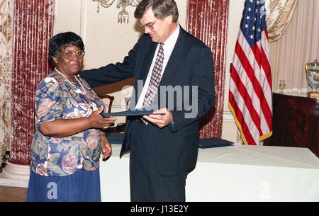 woman accepting award taking a picture Stock Photo