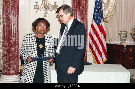 woman accepting award taking a picture Stock Photo