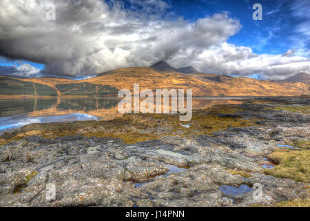 Isle of Mull Scotland UK beautiful Loch Scridain with view to Ben More and Glen More mountains on calm spring day in colourful hdr Stock Photo