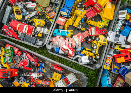 Boxes of toy cars autos on sales in a market Stock Photo