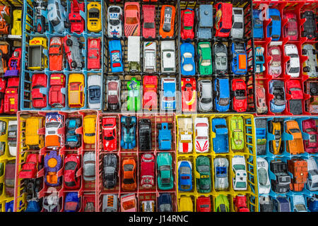 Boxes of toy cars autos on sales in a market Stock Photo