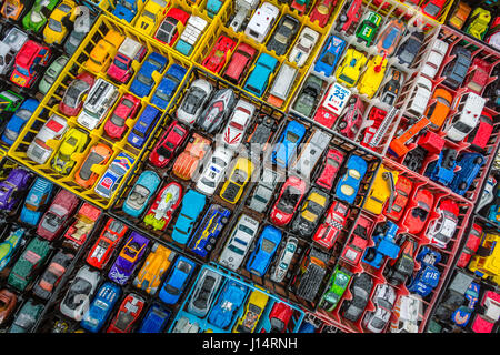 Boxes of toy cars autos on sales in a market Stock Photo