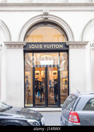 Louis Vuitton Shop in Via Roma Street with business man walking past in ...