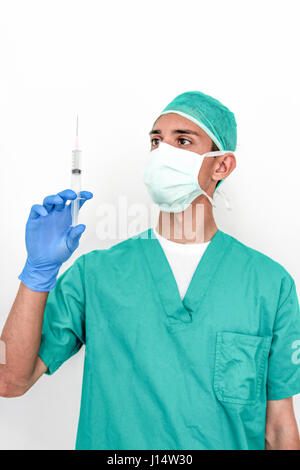 A doctor with gloves holds a syringe Stock Photo