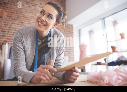 Young fashion designer at her studio Stock Photo