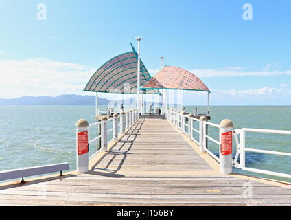 Townsville Strand Park and Beach and the Strand Jetty looking atmospheric on a hot Autumn day in the Australian tropics Stock Photo