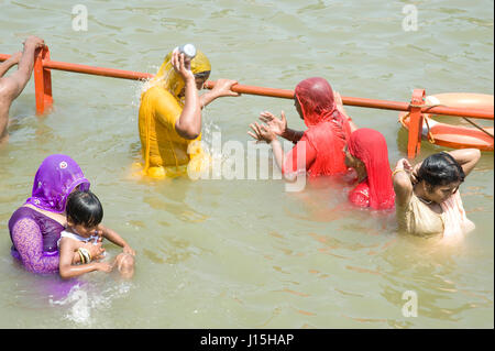 Pilgrims taking holy dip in kshipra river, ujjain, madhya pradesh, india, asia Stock Photo