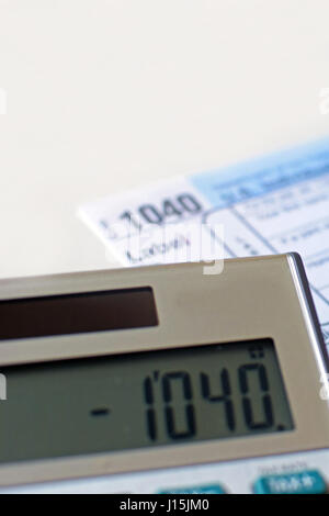 USA tax form 1040 and calculator. Vertical image. Stock Photo