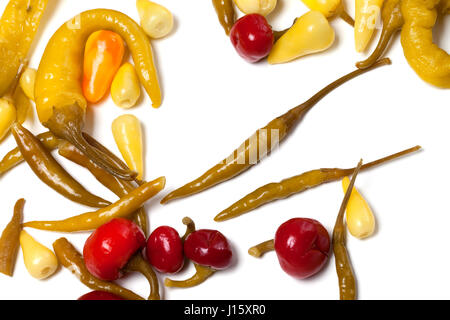 Mix of hot marinated peppers isolated on white background. Food background. Stock Photo