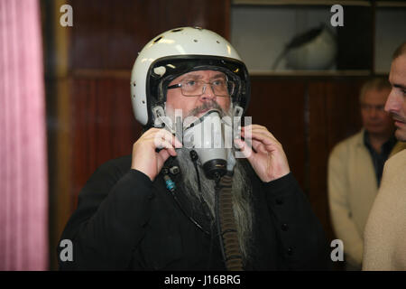 MOSCOW, RUSSIA: COULD THIS be the world’s most religious wannabe cosmonaut? Pictures show how the bearded Russian Orthodox priest practices his zero-G skills, travelled in a MiG fighter on a journey to the edge of space and most importantly takes the last confession of Russian cosmonauts before they leave the surface of our planet. Father Hegumen Iov is responsible for the souls of nearly all Russia’s cosmonauts, but the rector of Transfiguration Church in Russia’s Star City took his life in his hands by travelling in a MiG-29UB at 1,100 miles-per hour at over 11-miles above the surface of Ear Stock Photo