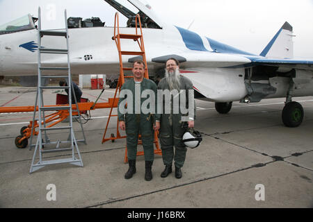 MOSCOW, RUSSIA: COULD THIS be the world’s most religious wannabe cosmonaut? Pictures show how the bearded Russian Orthodox priest practices his zero-G skills, travelled in a MiG fighter on a journey to the edge of space and most importantly takes the last confession of Russian cosmonauts before they leave the surface of our planet. Father Hegumen Iov is responsible for the souls of nearly all Russia’s cosmonauts, but the rector of Transfiguration Church in Russia’s Star City took his life in his hands by travelling in a MiG-29UB at 1,100 miles-per hour at over 11-miles above the surface of Ear Stock Photo