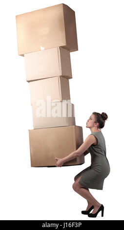 Woman carrying heavy boxes Stock Photo