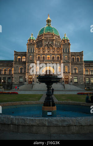 Still Fountain In Front Of Illuminated Parliament Building, Victoria, British Columbia, Canada Stock Photo