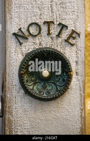 Antique door bell button, aged and rusty Stock Photo