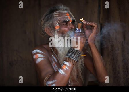 Varanasi Holy man (sadhu ) smoking Hashish Stock Photo