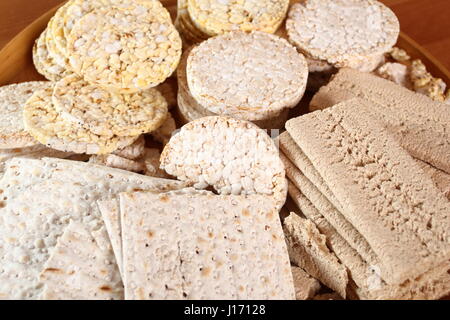 Different types of crispbread. Rice cake, Corn Thins, Matzo, Rye Crispbread. Stock Photo