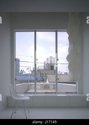 Window view towards city from upper floor. Townhouse in Tokyo, Tokyo, Japan. Architect: Claus en Kaan, 2008. Stock Photo