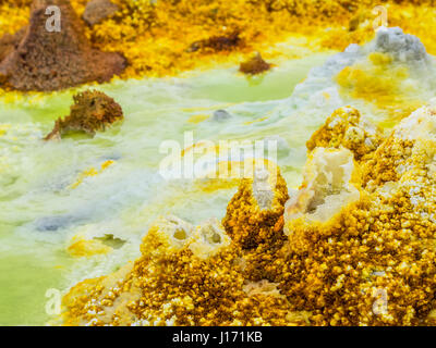 Mineral formations at sulphur lake Dallol in a volcanic crater in the Danakil Depression, northeast of the Erta Ale Range in Ethiopia. The lake with i Stock Photo