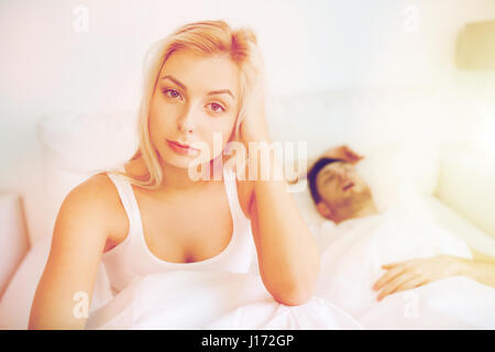 awake woman having insomnia in bed Stock Photo