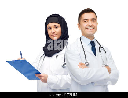 happy doctors with clipboard and stethoscopes Stock Photo