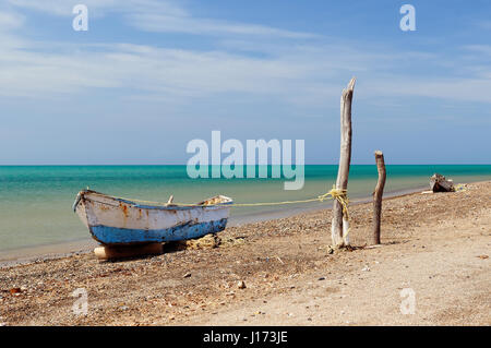 Colombia, wild coastal desert of Penisula la Guajira near  the Cabo de la Vela resort. The picture present traditional fishing boat. Stock Photo