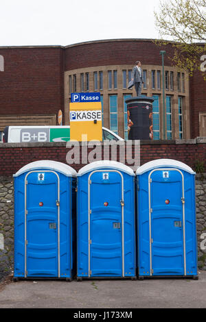 Europe, Germany, Duesseldorf, mobile toilets on the banks of the river Rhine.