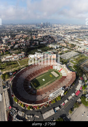 Los Angeles, California, USA - April 12, 2017:  Aerial view of the historic Coliseum stadium with downtown in background. Stock Photo