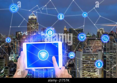 Network of connect digital tablet with wireless communication network, business district with office building, abstract image visual, internet of thin Stock Photo