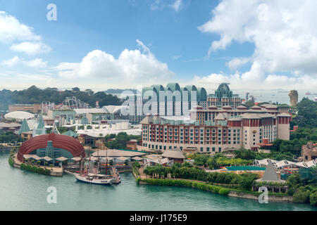 SINGAPORE - 26 February, 2017 : Tourists and theme park visitors taking pictures of the large rotating globe fountain in front of Universal Studios in Stock Photo