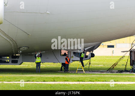 Cardington, UK. 18th Apr, 2017. The Hybrid Air Vehicles Airlander 10 is moored to the new Mobile Mooring Mast as engineers and ground crew check the Auxiliary Landing System (ALS), which has been added to allow the aircraft to land safely at a greater range of landing angles.. The aircraft is almost ready to begin it's 2017 flight test programme. Photo Credit: Mick Flynn/Alamy Live News Stock Photo