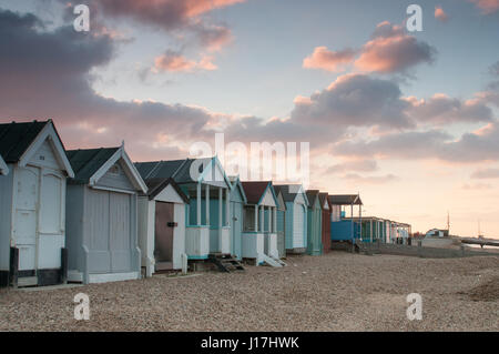 Thorpe Bay, Southend-on-Sea, Essex, UK. 19th Apr, 2017. UK Weather: Sunrise over Thorpe Bay - view of clouds above beach huts Credit: Ben Rector/Alamy Live News Stock Photo