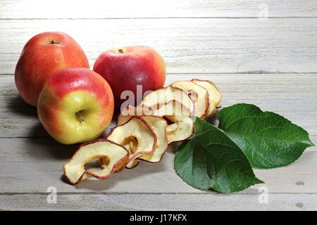 homemade dried apple rings on wooden background Stock Photo