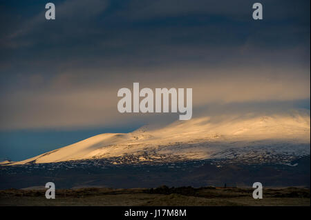 Dusk on snow capped mountains in Iceland Stock Photo