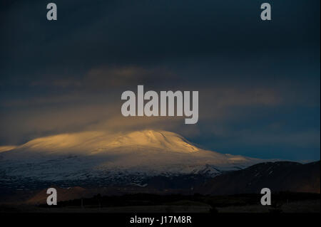 Dusk on snow capped mountains in Iceland Stock Photo