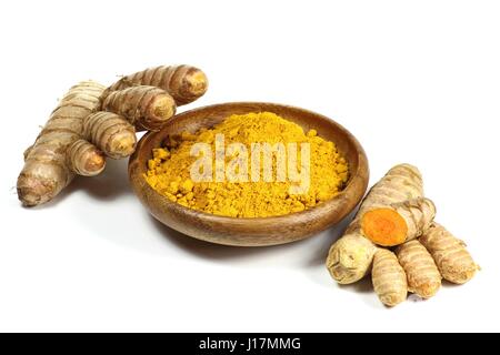 turmeric powder and rhizome isolated on white background Stock Photo