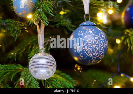 Christmas tree lights and decorations, hanging baubles, christmas scene Stock Photo