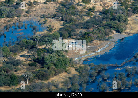 Aerial view of a isolated house in the Okavango Delta near Maun town, Moremi Game Reserve, Botswana Stock Photo