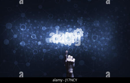 Technology conceptual image with gear digital symbol on dark background Stock Photo