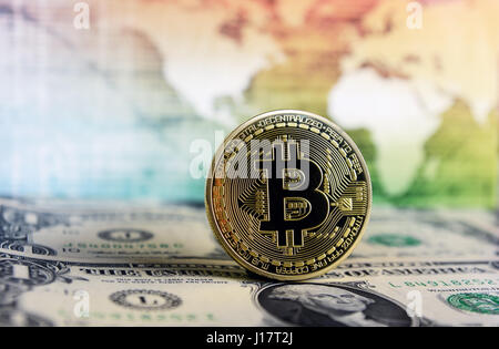 Bitcoin currency on a world map  background on  dollar bill Stock Photo